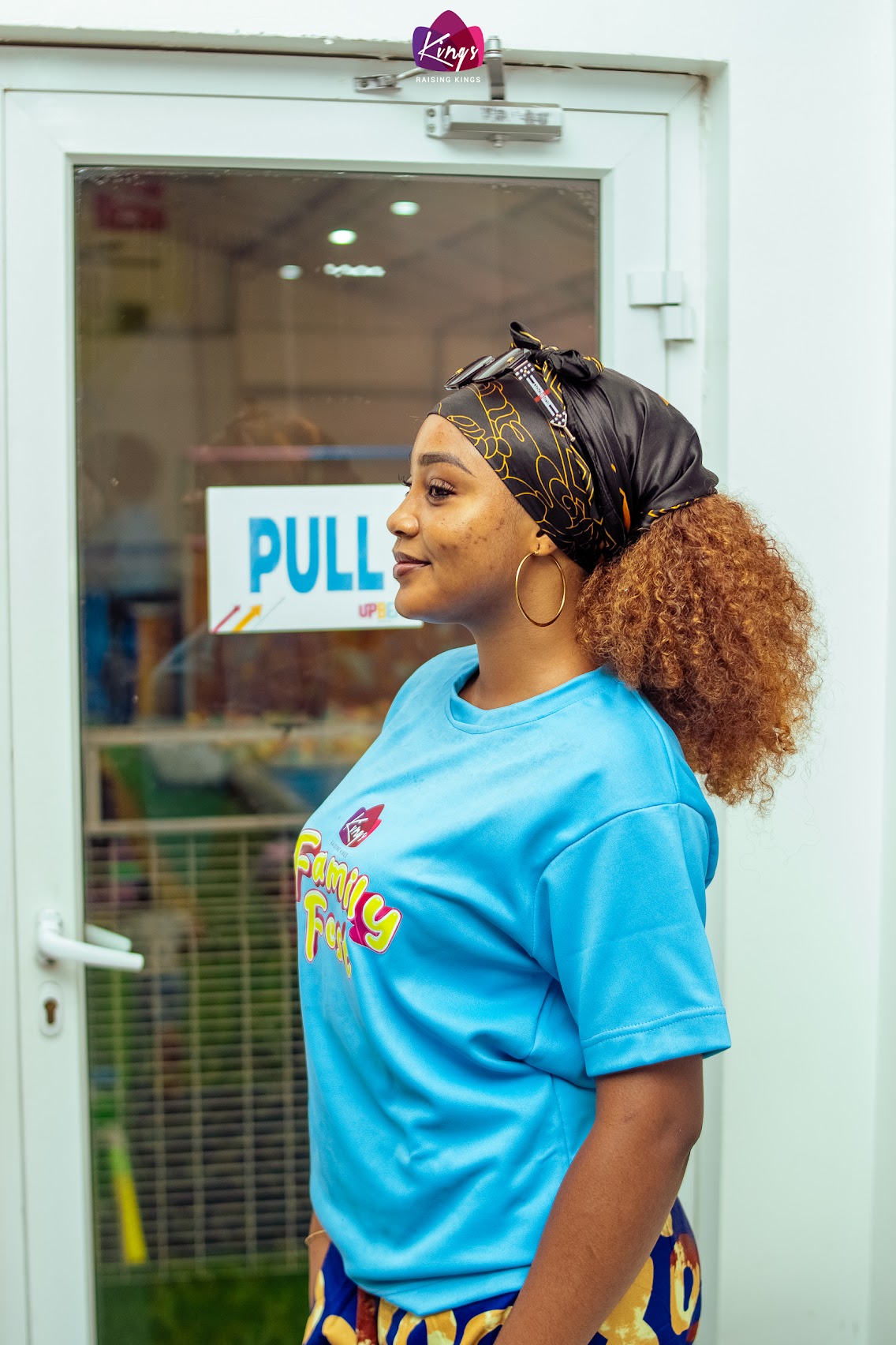 KINGS Family Fest host in a blue event shirt